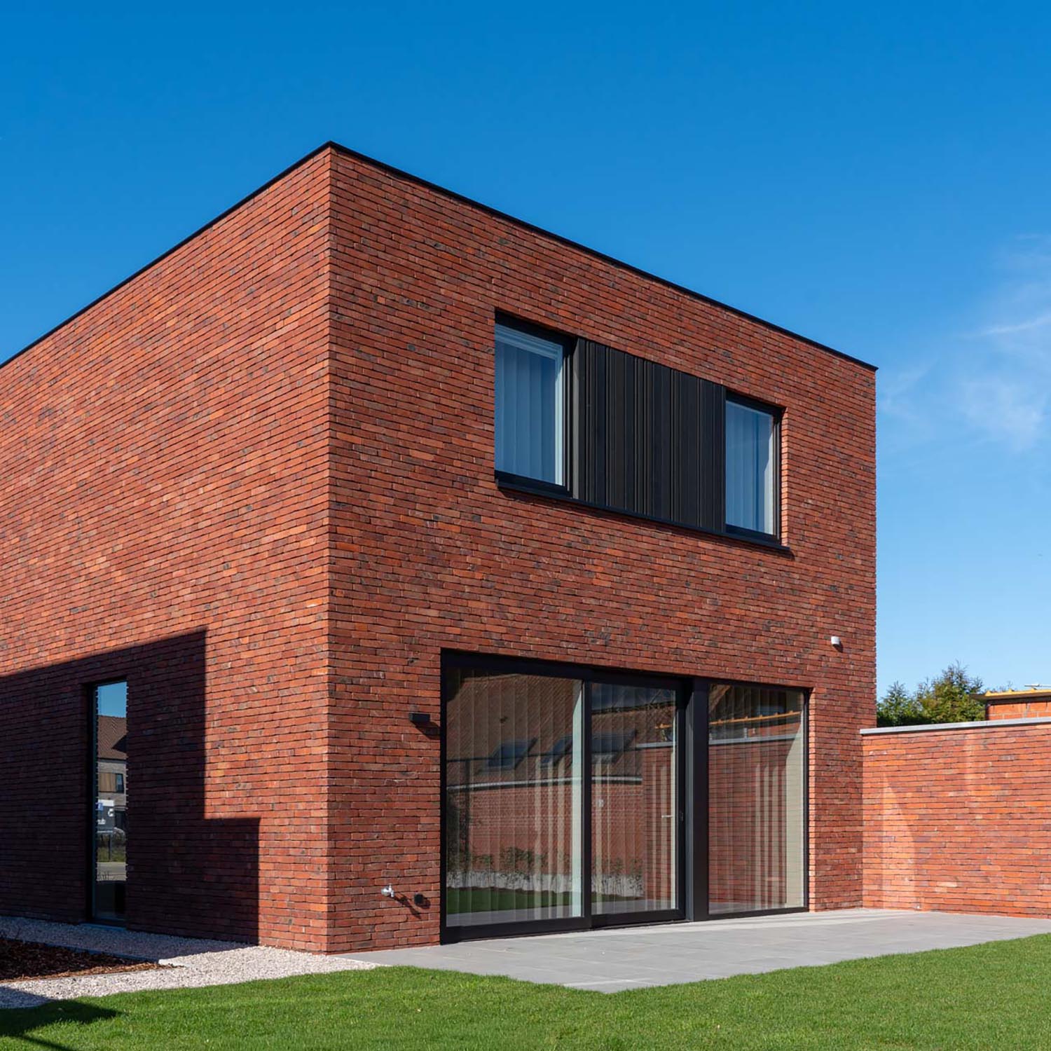 ’t Park Tielt – achtergevel van moderne nieuwbouwvilla met terras en tuin